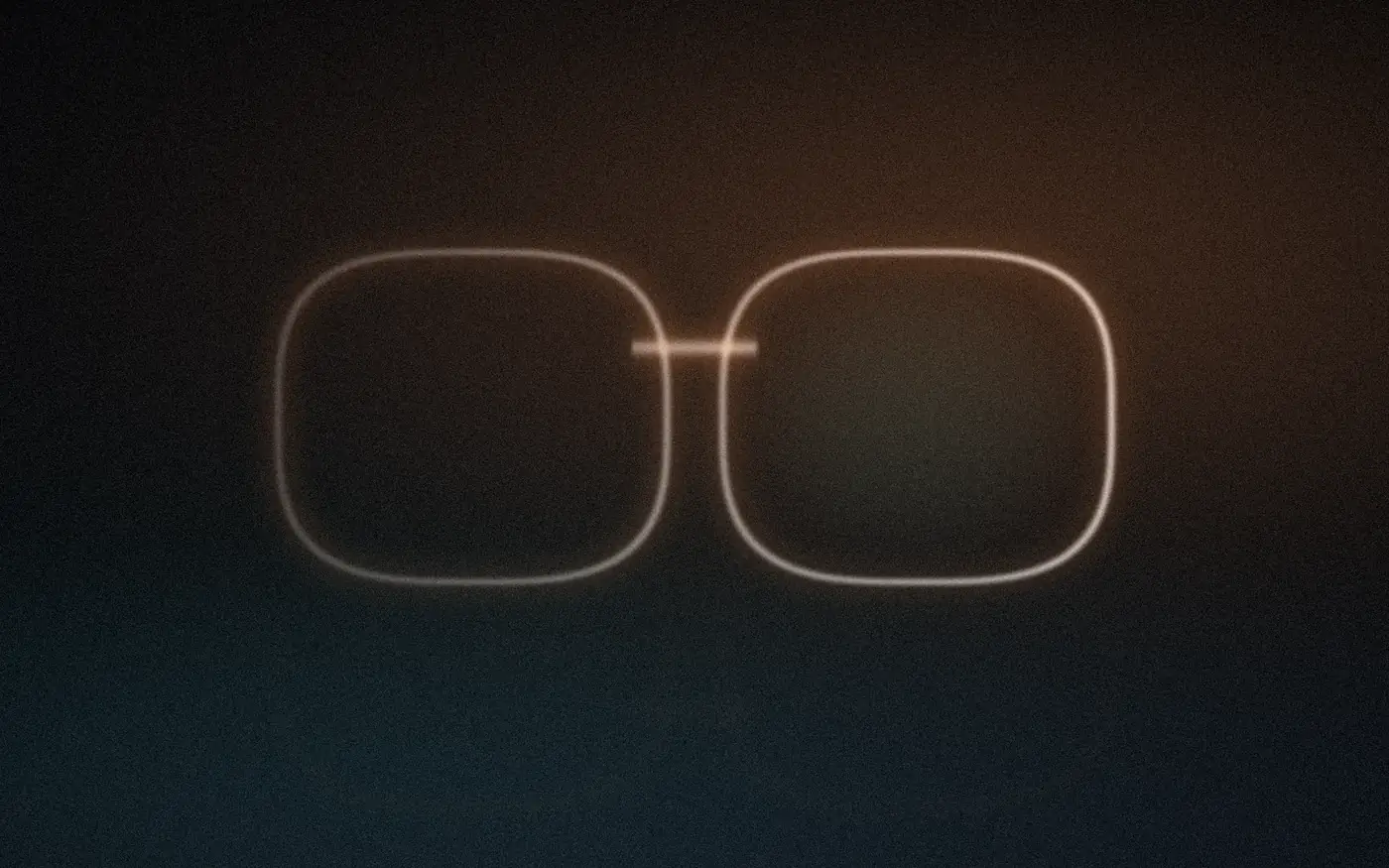 A thin lit pair of eyewear frames floating in a dark room, amber light from the upper right.